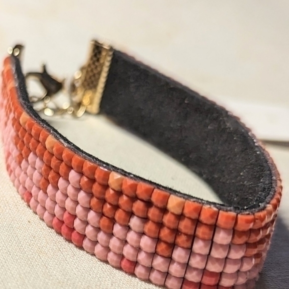 Charming Charlie wrist band cuff bracelet in pink beading and golden clasp. NWT